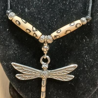 Dragonfly necklace, Glass box locket, blown glass mushroom pendant, and a Moose on a stone pendant