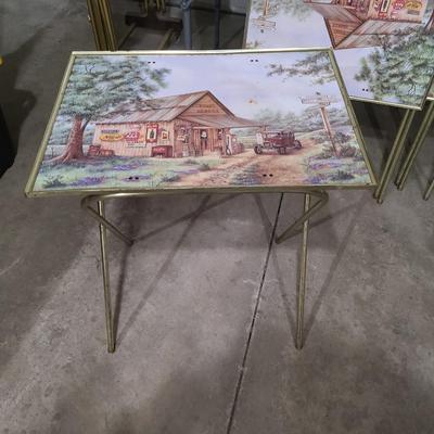 Sale Photo Thumbnail #66: 6 tables total. Four with the artwork on top and two just plain wood. 

Great condition on both sets