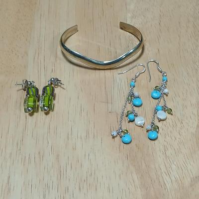 .925 marked dangle earrings and a sterling marked bracelet