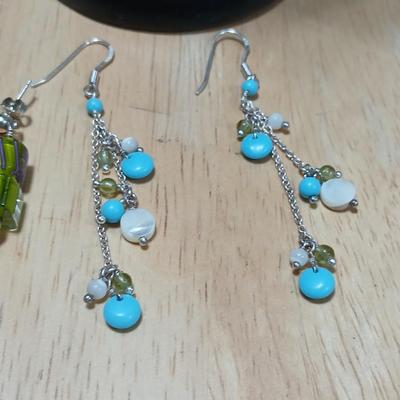 .925 marked dangle earrings and a sterling marked bracelet