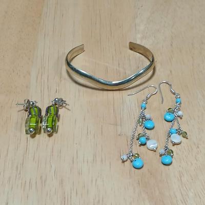 .925 marked dangle earrings and a sterling marked bracelet