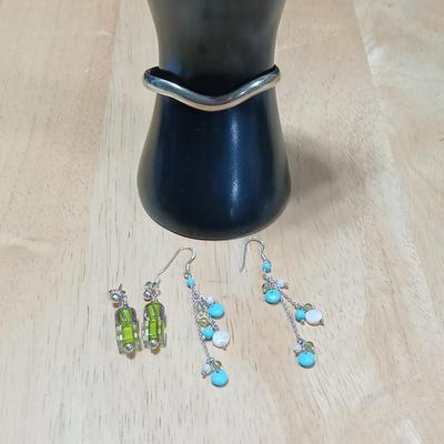 .925 marked dangle earrings and a sterling marked bracelet