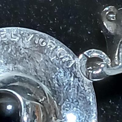 Vintage signed earrings marked .925 with purple centers