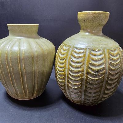Small Green toned pottery Vases - one signed on base
