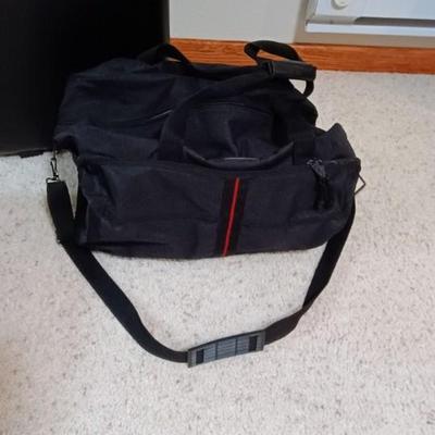 HARD SIDED AMERICAN TOURISTER SUITCASE ON 2 WHEELS AND 2 LAKORUS SOFT BAGS