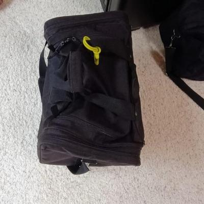 HARD SIDED AMERICAN TOURISTER SUITCASE ON 2 WHEELS AND 2 LAKORUS SOFT BAGS