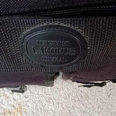 HARD SIDED AMERICAN TOURISTER SUITCASE ON 2 WHEELS AND 2 LAKORUS SOFT BAGS
