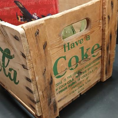 Vintage 1976 wooden Coca Cola crate with coca cola bottles, antique opener and a collectable book