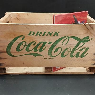 Vintage 1976 wooden Coca Cola crate with coca cola bottles, antique opener and a collectable book