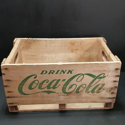 Vintage 1976 wooden Coca Cola crate with coca cola bottles, antique opener and a collectable book
