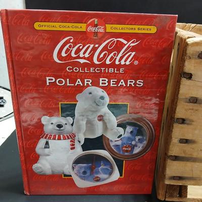 Vintage 1976 wooden Coca Cola crate with coca cola bottles, antique opener and a collectable book