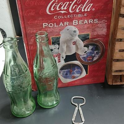 Vintage 1976 wooden Coca Cola crate with coca cola bottles, antique opener and a collectable book