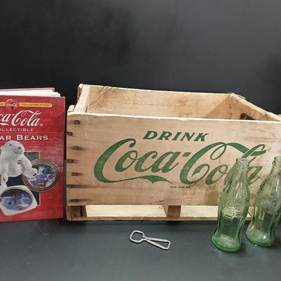 Vintage 1976 wooden Coca Cola crate with coca cola bottles, antique opener and a collectable book