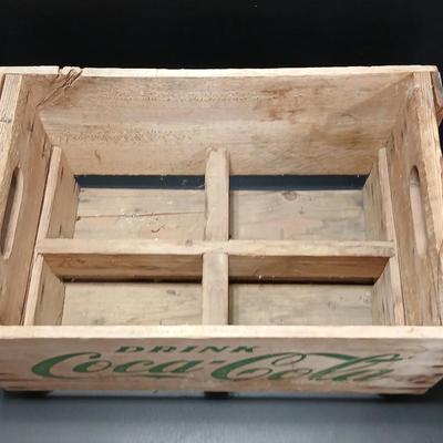 Vintage 1976 wooden Coca Cola crate with coca cola bottles, antique opener and a collectable book