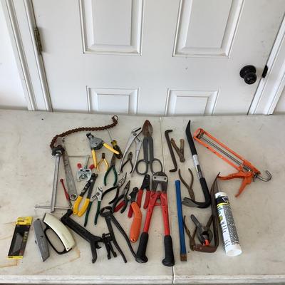 G887 Lot of Assorted Tools , Crowbars, Culk Gun, Metal Cutter,Bolt Cutters and more