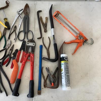 G887 Lot of Assorted Tools , Crowbars, Culk Gun, Metal Cutter,Bolt Cutters and more