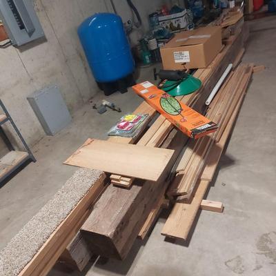 Lot of lumber in basement.