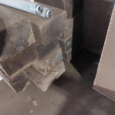 Lot of lumber in basement.