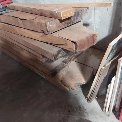 Lot of lumber in basement.
