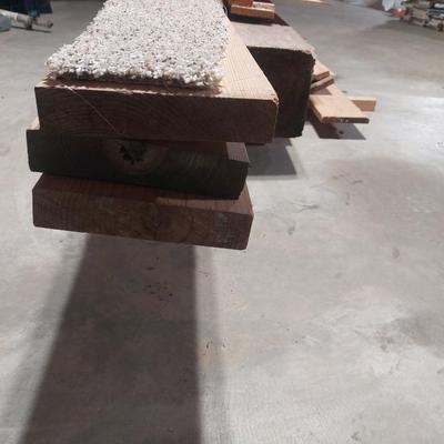 Lot of lumber in basement.