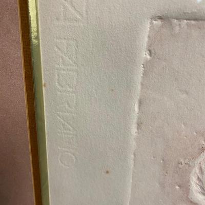 Signed and humbered embossed paper art