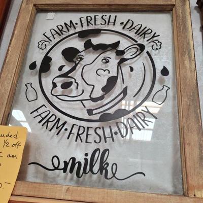 Vintage wood window frame with dairy cow 