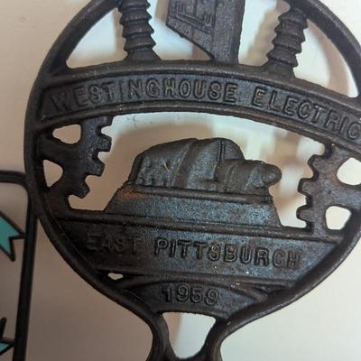 Vintage Westinhouse Cast Iron Trivet & Plastic Plaque