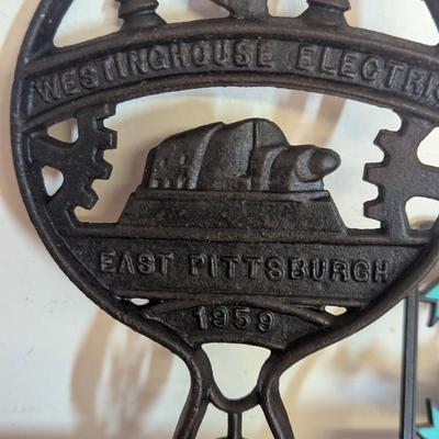 Vintage Westinhouse Cast Iron Trivet & Plastic Plaque