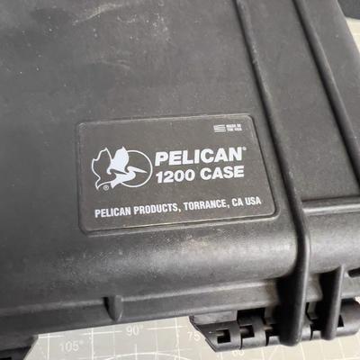 Pelican Case with A broken Latch and a Lunch Bucket