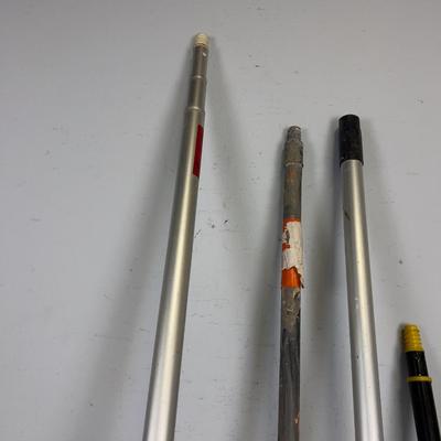 Mostly Adjustable Height Paint Sticks Wood and Aluminum. 