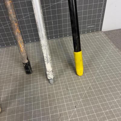 Mostly Adjustable Height Paint Sticks Wood and Aluminum. 
