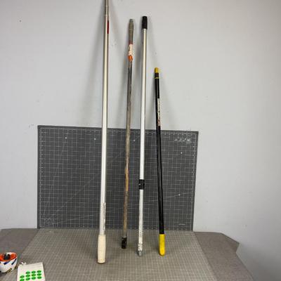 Mostly Adjustable Height Paint Sticks Wood and Aluminum. 