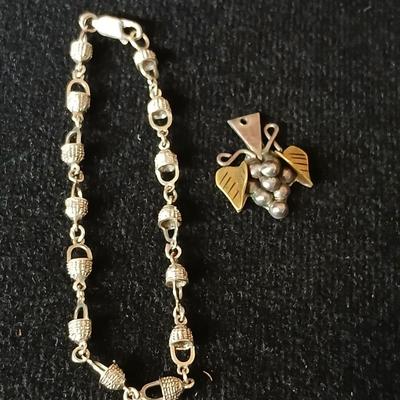 .925 Nantucket basket tennis bracelet and a .925 Taxco Mexico Sterling Silver Grape Cluster pendant