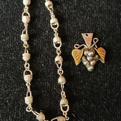 .925 Nantucket basket tennis bracelet and a .925 Taxco Mexico Sterling Silver Grape Cluster pendant