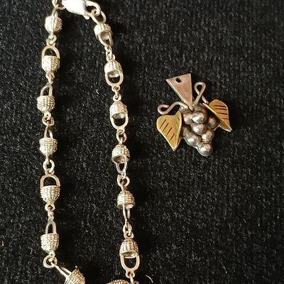 .925 Nantucket basket tennis bracelet and a .925 Taxco Mexico Sterling Silver Grape Cluster pendant