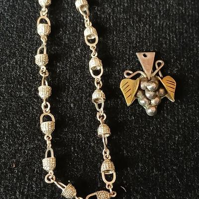 .925 Nantucket basket tennis bracelet and a .925 Taxco Mexico Sterling Silver Grape Cluster pendant