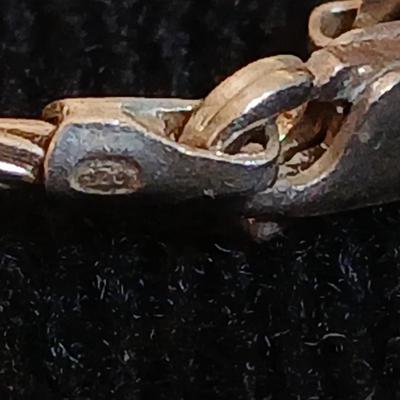 .925 Italy marked cable choker necklace a .925 marked pair of vintage blue earrings and a stain glass / stone like feather pendant