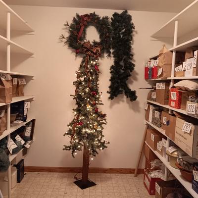 VERY NICE WREATH, GARLAND AND A FAUX LIGHTED TREE WITH LIFE LIKE TRUNK
