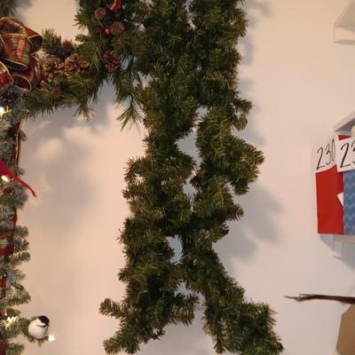 VERY NICE WREATH, GARLAND AND A FAUX LIGHTED TREE WITH LIFE LIKE TRUNK