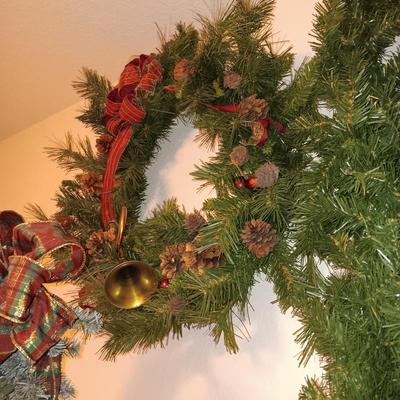 VERY NICE WREATH, GARLAND AND A FAUX LIGHTED TREE WITH LIFE LIKE TRUNK