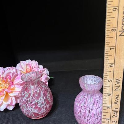 Pink blown glass vases and flowers