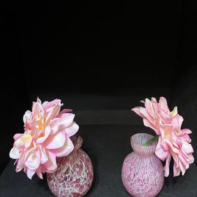 Pink blown glass vases and flowers