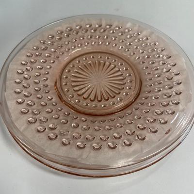 16 small pink depression glass plates