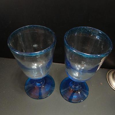 Mexican Hand Blown Colbalt Blue Stem & Rim Goblet Glasses with a vintage blue glass vase with silver colored decorative design