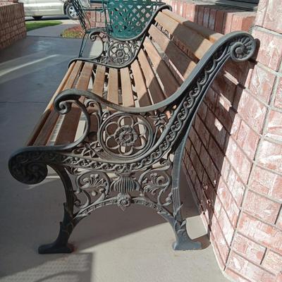 ORNATE CAST IRON PATIO BENCH WITH WOODEN SLATS