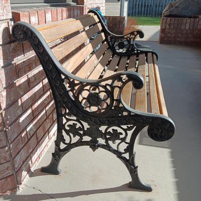 ORNATE CAST IRON PATIO BENCH WITH WOODEN SLATS