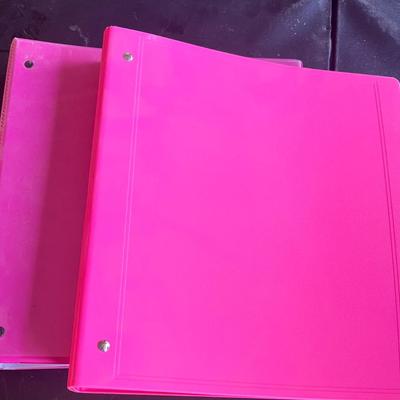 2 pink binders