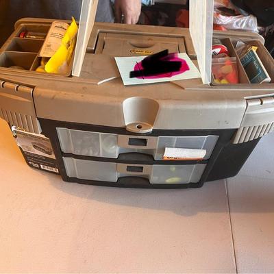 Fish tackle box filled with fishing items