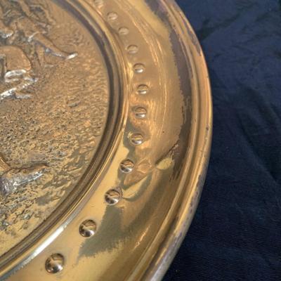 LOT 31: Collection of Embossed Brass Wall Plate
