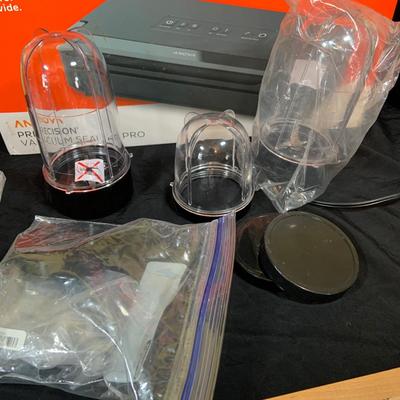 LOT 33: Magic Bullet with Extra Tops and a Anova Vacuum Sealer Pro In Original Box